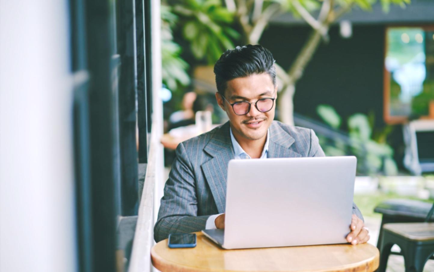 Students working on game architecture code on multiple screens